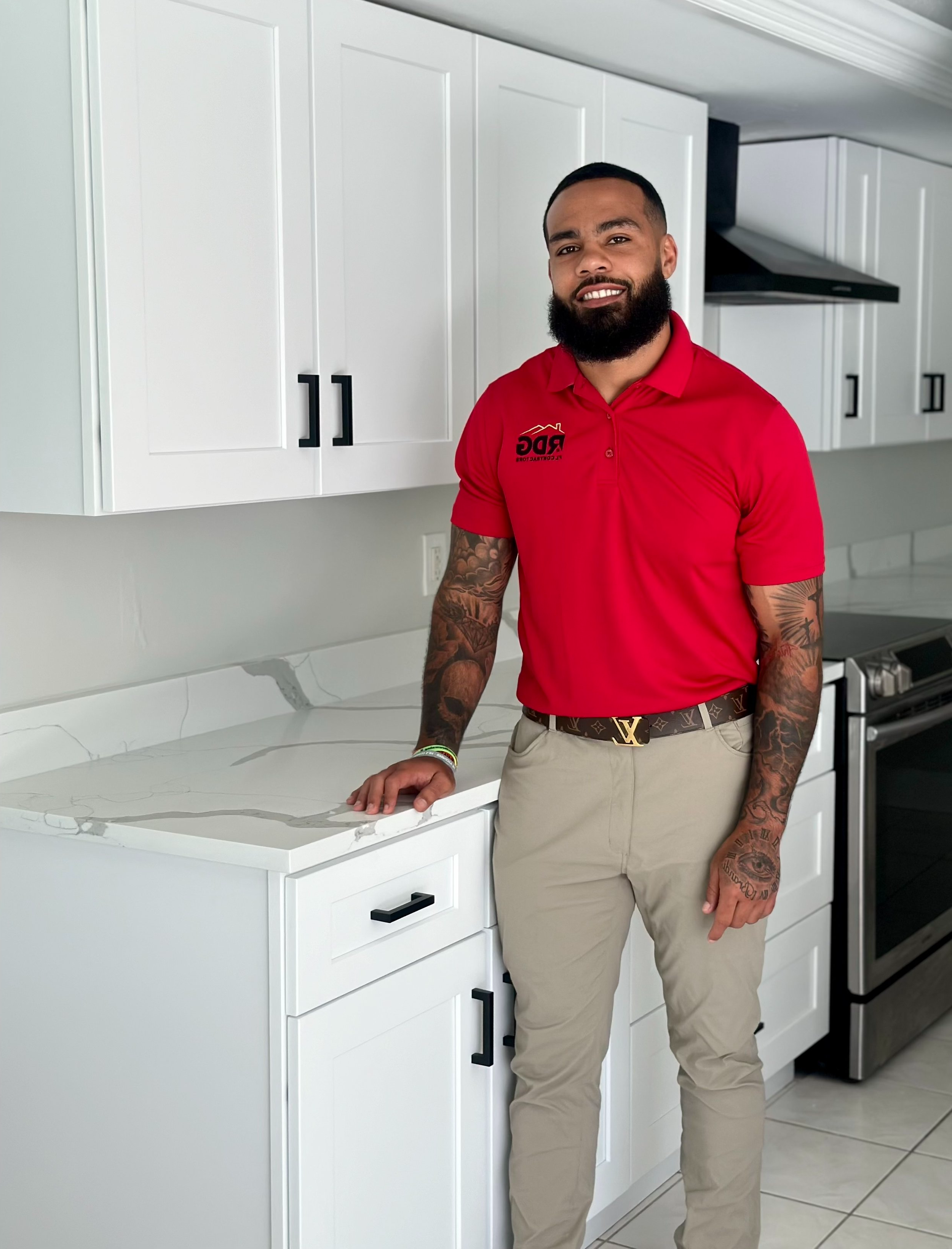 Rob Haynes, owner of Rob The Builder Construction, standing in a completed kitchen remodel